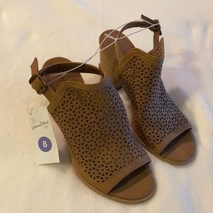 Brown heeled sandals.